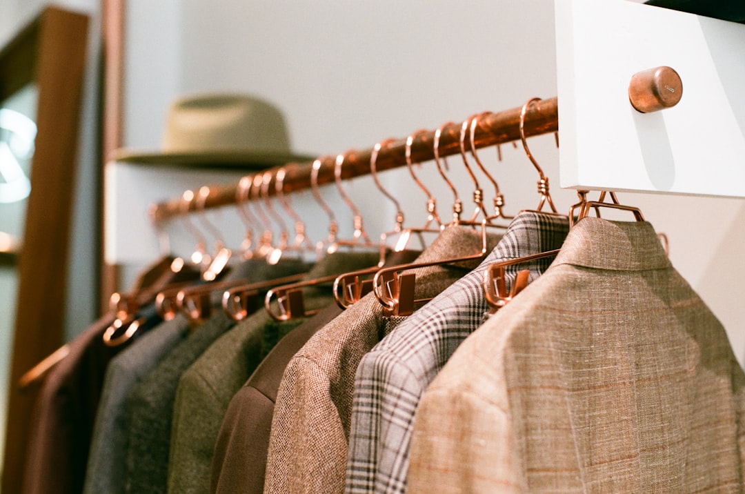 a-rack-of-clothes-hanging-on-a-wall-iv08-pfh2nq