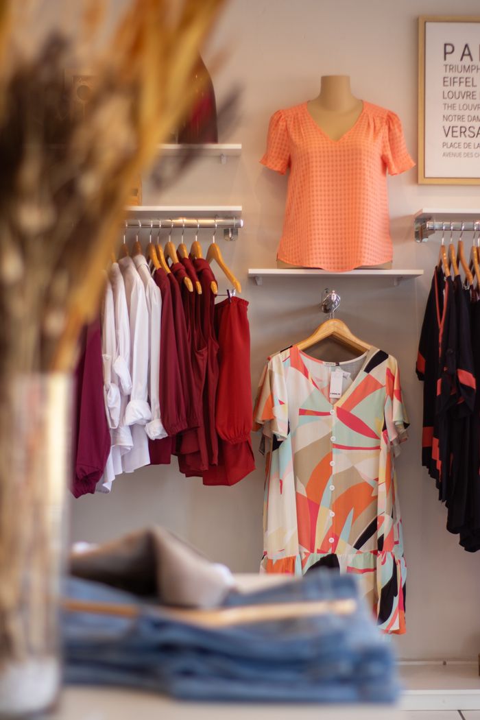 Stylish boutique clothing display with vibrant dresses in Cuiabá. Perfect for fashion and retail concepts.