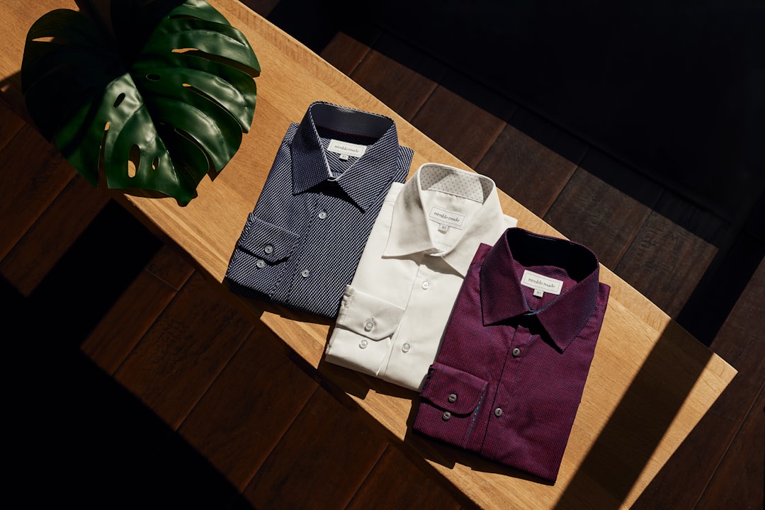 white-button-up-shirt-on-brown-wooden-table-7rims-nmsbc